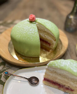 Light vanilla sponge, raspberry puree, vanilla pastry cream and chantilly - all covered in thin layer of almond marzipan